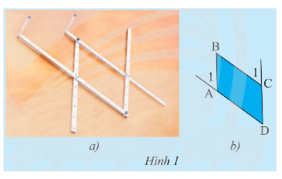 Hình 1a là hình ảnh của một thước vẽ truyền dùng để phóng to hay thu nhỏ một hình vẽ có sẵn. Dùng thước đo góc để đo số đo của các cặp góc (ảnh 1)